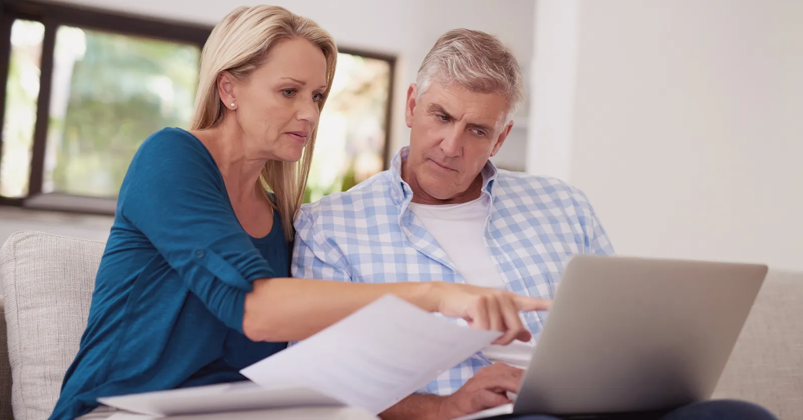 Couple completing a lead form on a laptop, showing online lead generation for a luxury product success story.