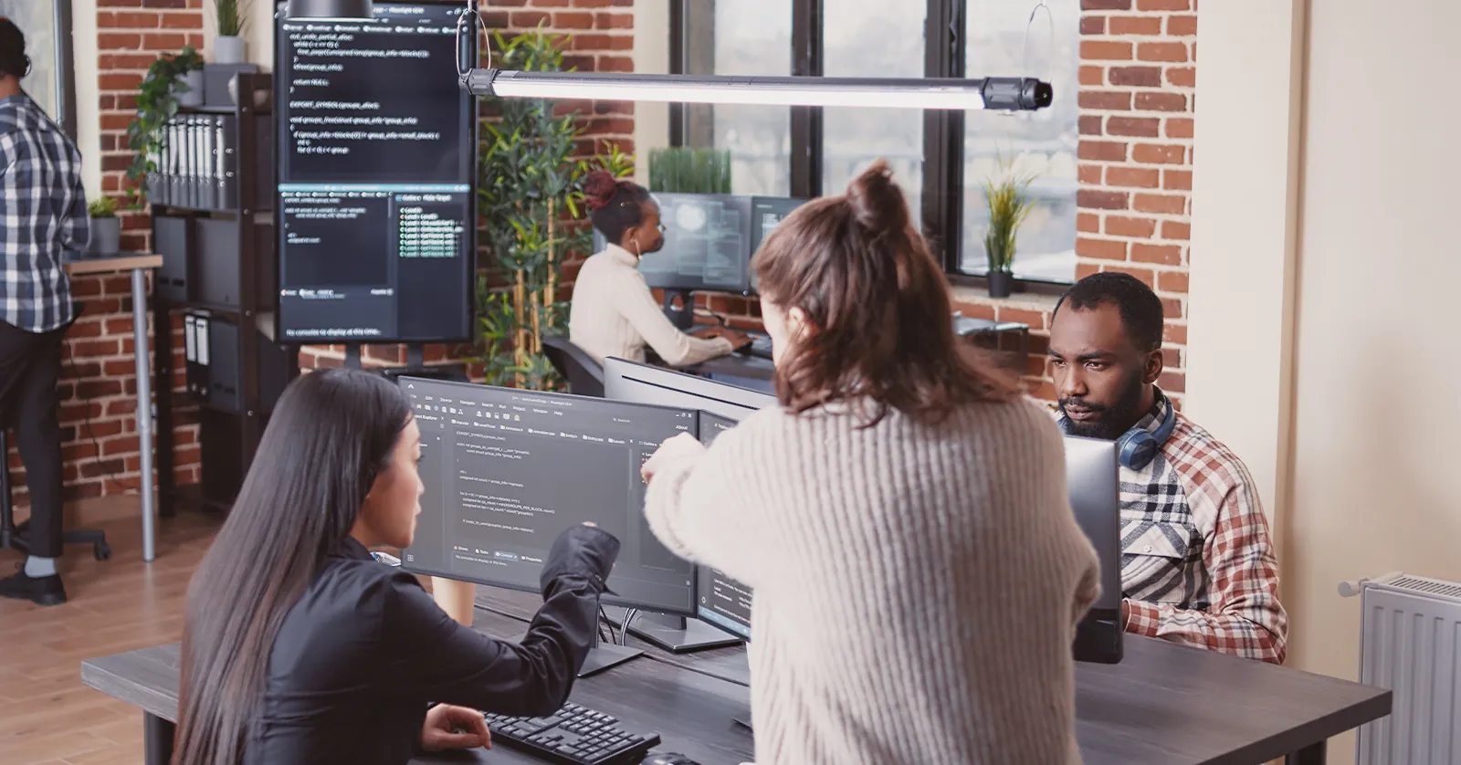 Team working at computers, symbolizing our Instagram page management case study.