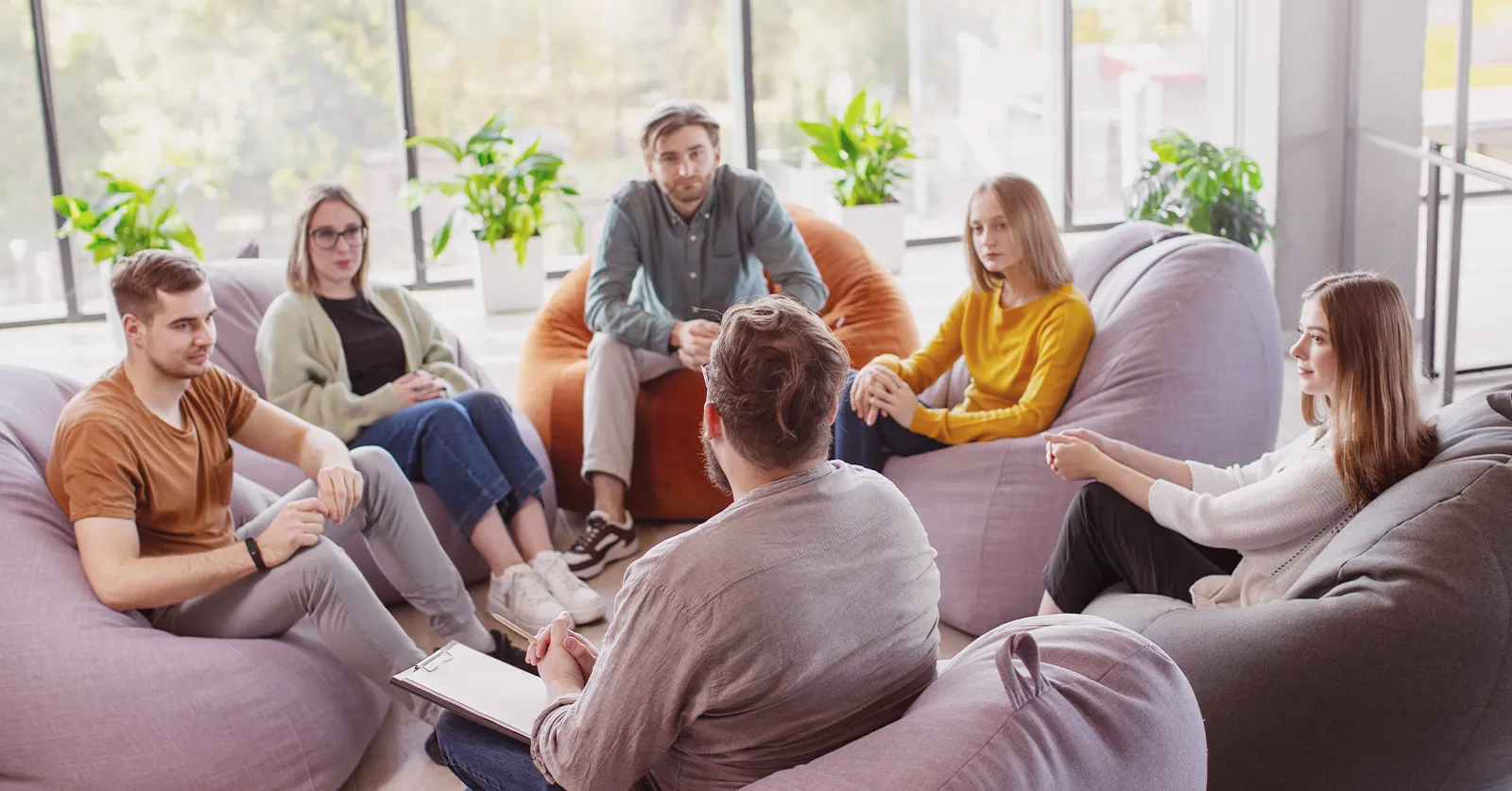 People in a tech meeting, representing our case study on online ticket sales success for a tech meetup.