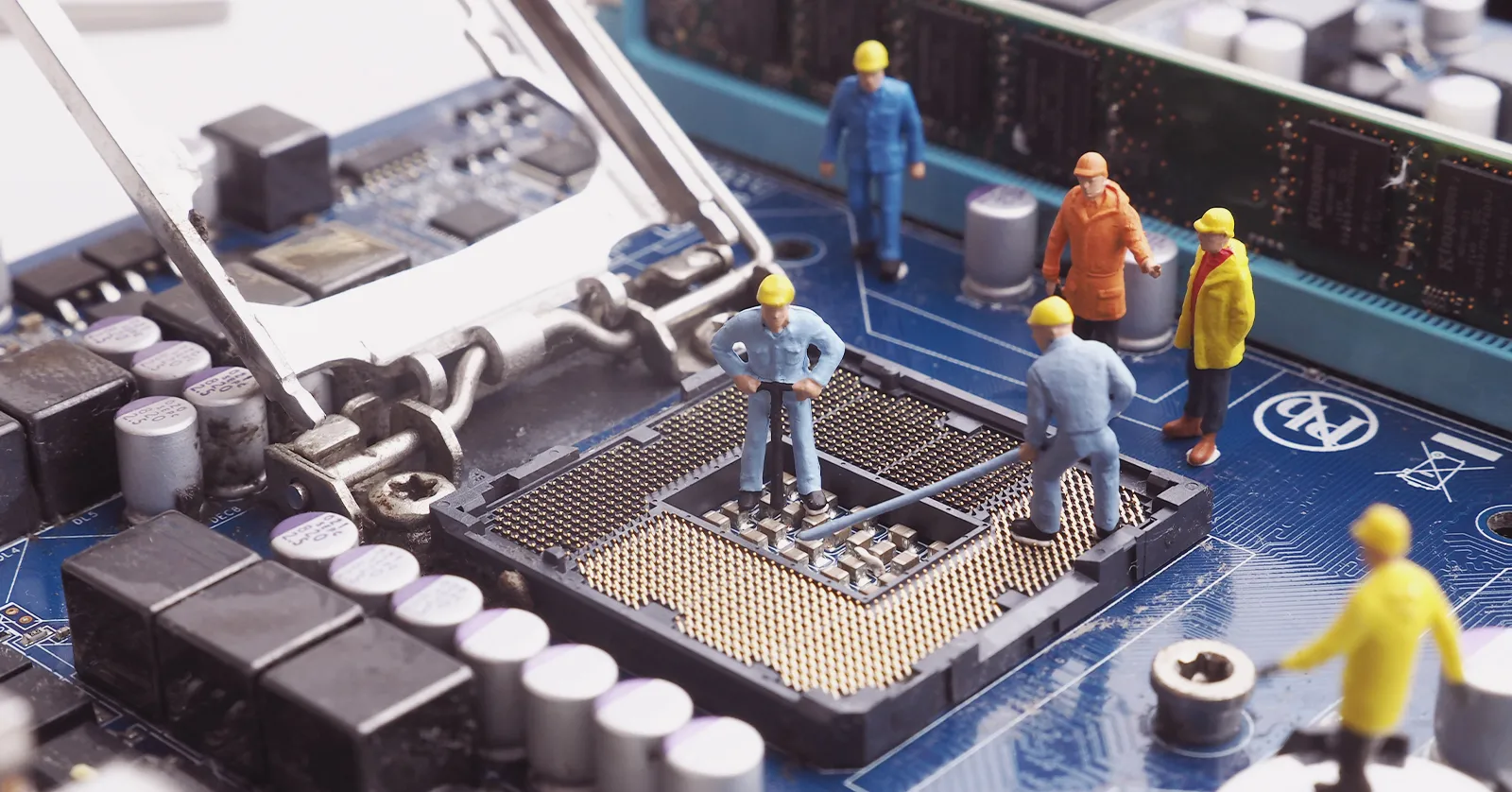 Miniature workers on a computer chip, representing our case study of an online product launch campaign for a tech product.